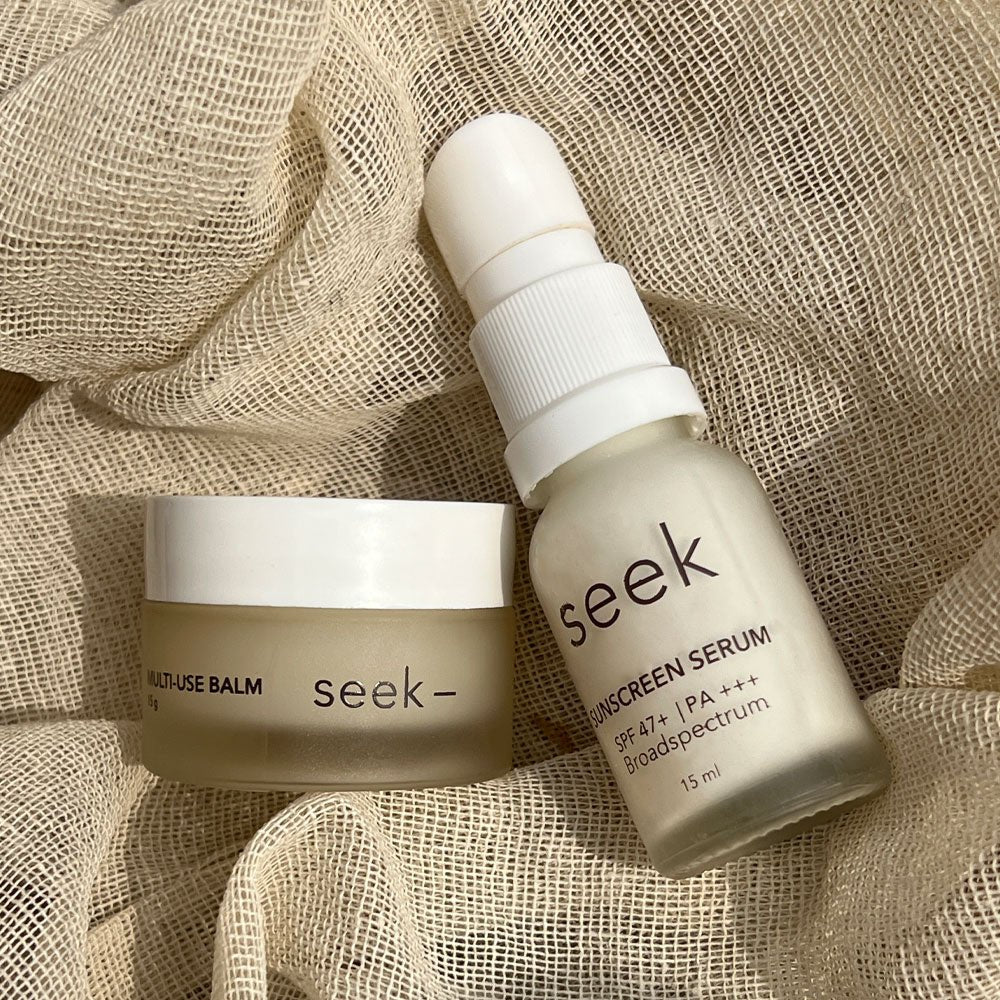 Applying sunscreen serum during morning skincare routine